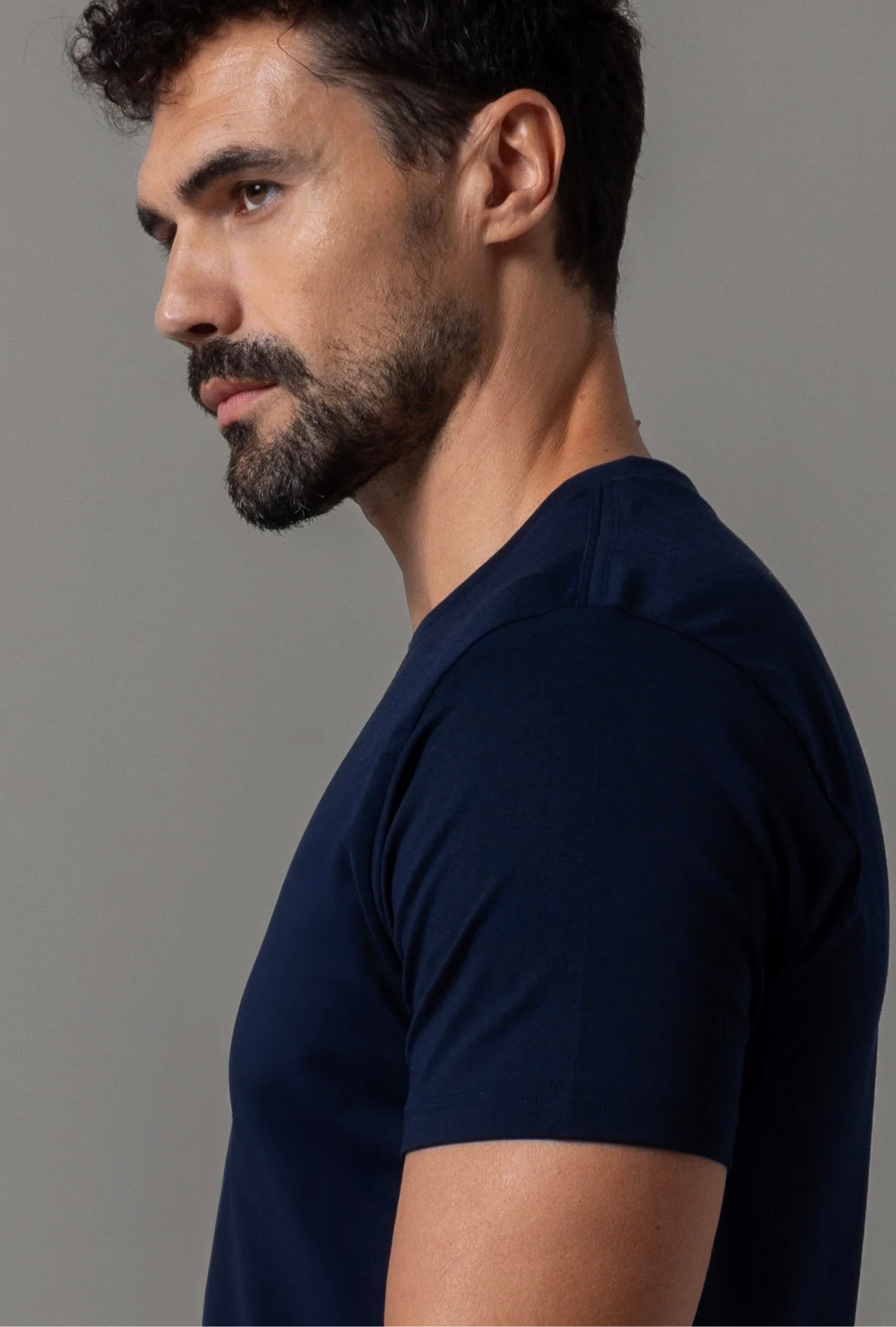 A man wearing a midnight blue Pima cotton T-shirt.